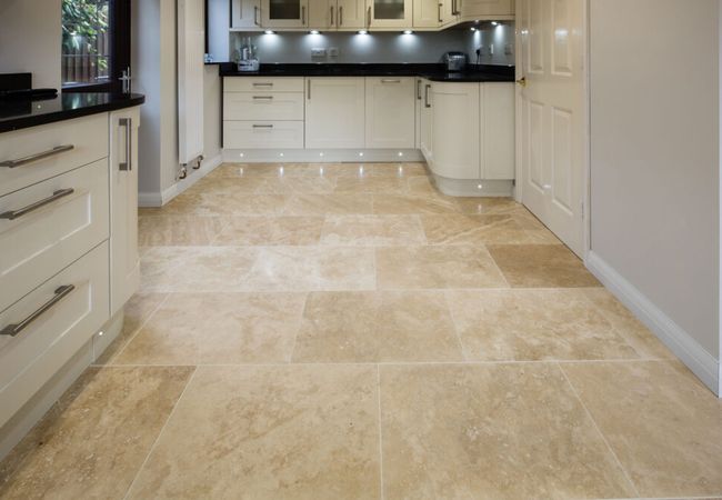 Kitchen with wood-look tiles in a warm oak finish; Kitchen with terracotta floor tiles; Kitchen with slate or travertine floor tiles; Kitchen with brick floor tiles; Kitchen with patterned tiles in a classic design